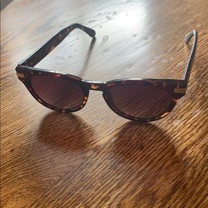 Cole Haan, tortoise shell polarized sunglasses.